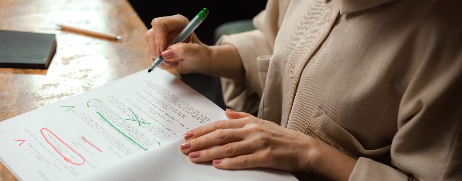 An older New Mexico adult reviewing Medicare paperwork and a calendar at home during the fall Annual Enrollment Period